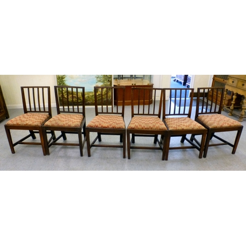 106 - A set of six late George III, oak framed dining chairs with drop-in seats, raised on square, tapered... 