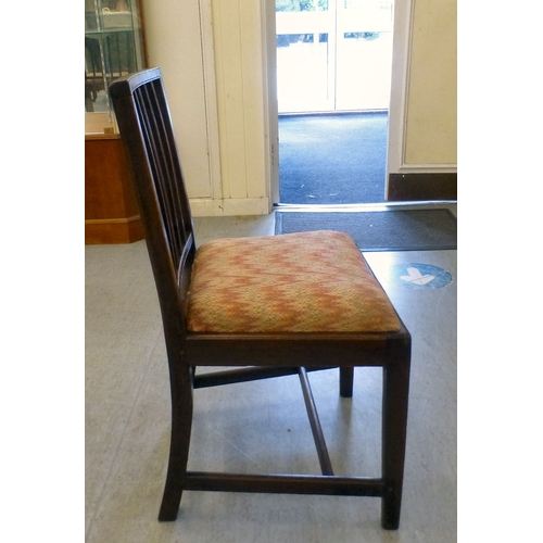 106 - A set of six late George III, oak framed dining chairs with drop-in seats, raised on square, tapered... 