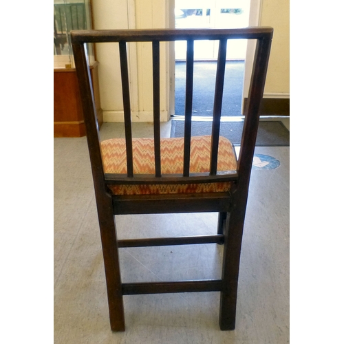 106 - A set of six late George III, oak framed dining chairs with drop-in seats, raised on square, tapered... 