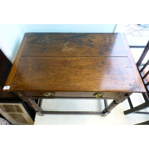 107 - A George III oak single drawer side table, raised on turned and block legs, united by stretchers&nbs... 