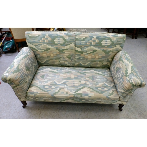 108 - A late Victorian/Edwardian and later fabric upholstered drop-end two person settee, raised on square... 