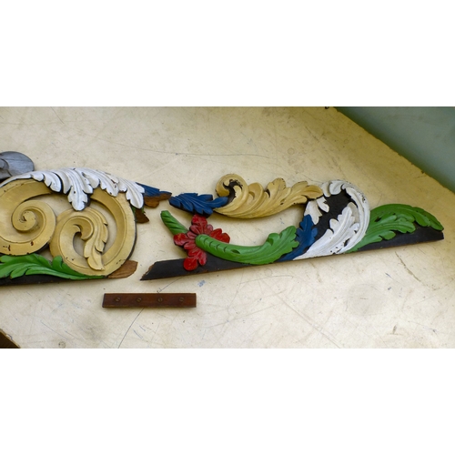118 - An early 20thC carved and overpainted, overmantel panel, decorated with C-scrolls and foliage&nbsp; ... 