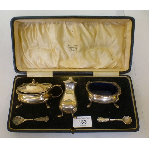 183 - A silver three piece condiments set, comprising a salt, mustard and pepper pot&nbsp; London 1937&nbs... 