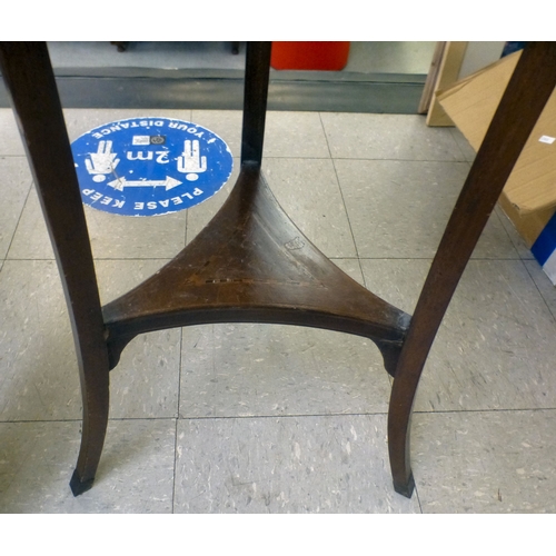 199 - An Edwardian string and ebony inlaid mahogany jardinière stand, raised on three carved legs, united ... 
