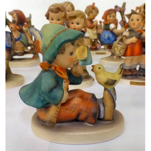 224 - Sixteen Goebel/Hummel china figures: to include 'Feeding Time'  all approx. 4