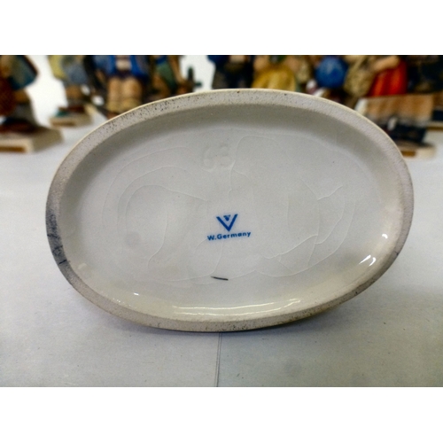 224 - Sixteen Goebel/Hummel china figures: to include 'Feeding Time'  all approx. 4