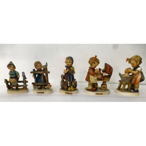 224 - Sixteen Goebel/Hummel china figures: to include 'Feeding Time'  all approx. 4