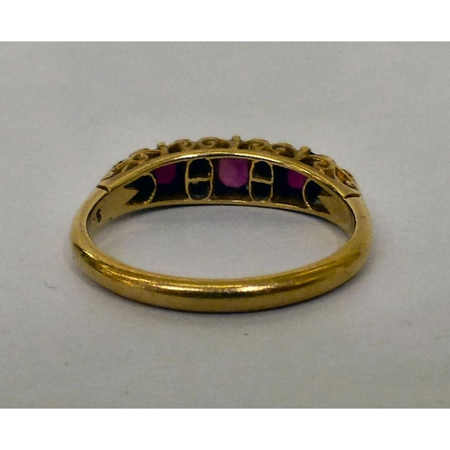231 - A yellow metal alternating ruby and diamond ring&nbsp; (approx. 4.2grms)&nbsp;