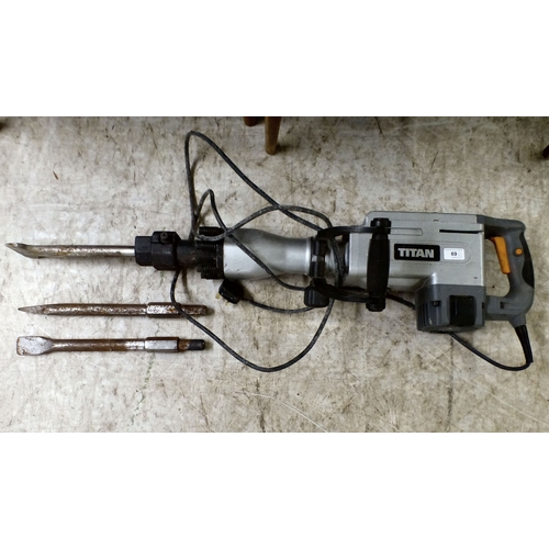 69 - An electrically powered Titan concrete breaker with two spare head attachments
