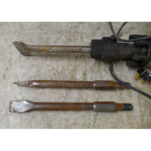 69 - An electrically powered Titan concrete breaker with two spare head attachments