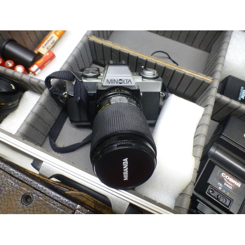 86 - Various eras of photographic equipment and accessories: to include a Minolta XG-1 camera