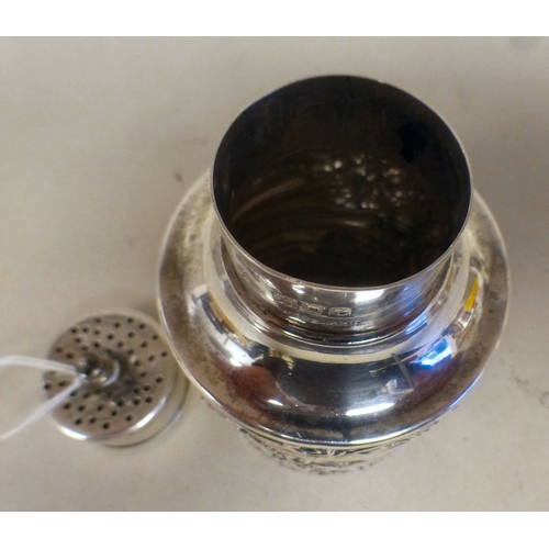 95 - A Victorian silver sugar sifter with whiplash decoration, the cartouche engraved with a stag&nbsp; L... 