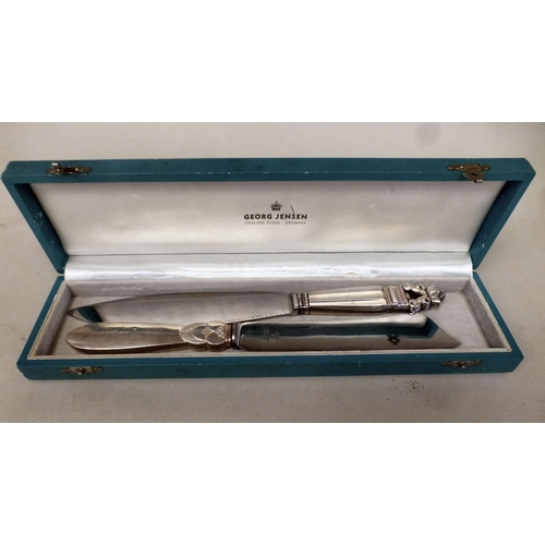 96 - A Georg Jensen Sterling silver handled cake knife with an acorn pattern terminal  boxed  10.5