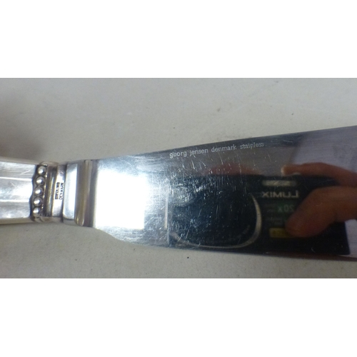 96 - A Georg Jensen Sterling silver handled cake knife with an acorn pattern terminal  boxed  10.5