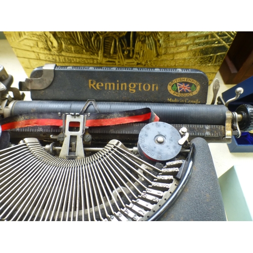 99 - A mixed lot: to include a Remington typewriter; and an embossed brass magazine rack&nbsp; 11