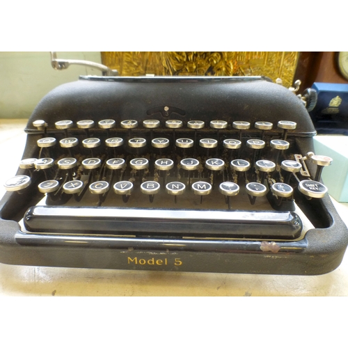 99 - A mixed lot: to include a Remington typewriter; and an embossed brass magazine rack&nbsp; 11