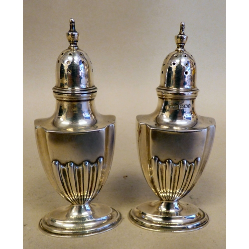 14 - A pair of Edwardian silver pedestal pepper pots  Sheffield 1900  4