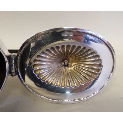 15 - An Elizabeth II silver teapot of Victorian influence demi-reeded form and wooden handle&nbsp; Sheffi... 