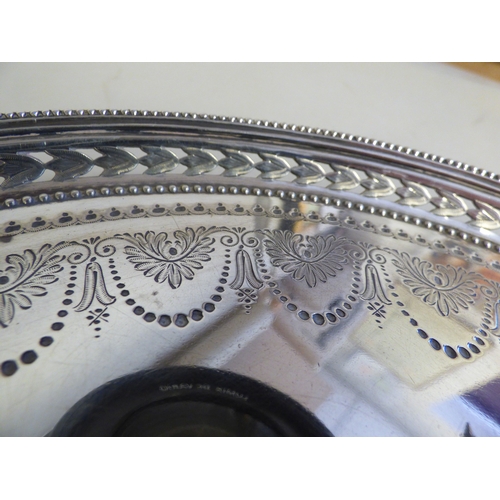 16 - A Victorian silver plate with a pierced border, raised on a trio of cast shell design feet&nbsp; Lon... 