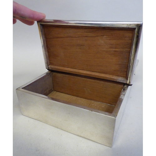 18 - A late Victorian silver bound and handled, twin hinged section, cedar lined cigar box, on hide feet ... 