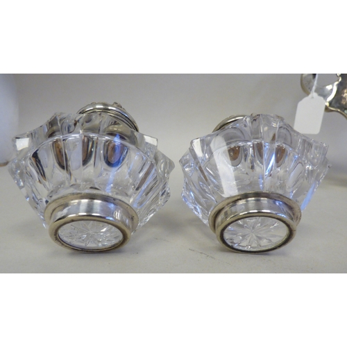 19 - An early 20thC cast white metal inkstand, surmounted by a white metal on copper military figure, kne... 