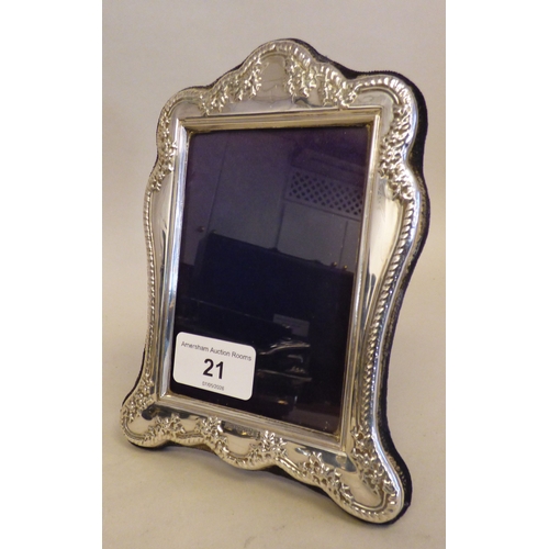21 - A silver photograph frame of Edwardian influence, on a fabric easel back  modern London marks  3