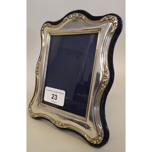 23 - A silver photograph frame of Edwardian influence, on a fabric easel back  modern London marks  3