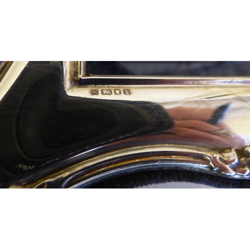 23 - A silver photograph frame of Edwardian influence, on a fabric easel back  modern London marks  3