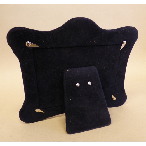 24 - A silver photograph frame of Edwardian influence, on a fabric easel back  modern London marks  3