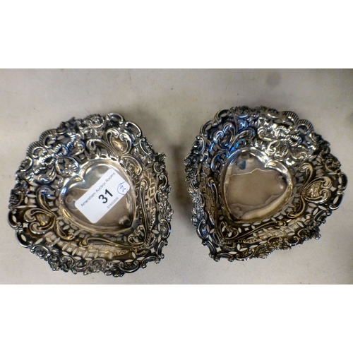 31 - A pair of late Victorian silver sweet dishes of oval pierced form  Birmingham 1900  4.5
