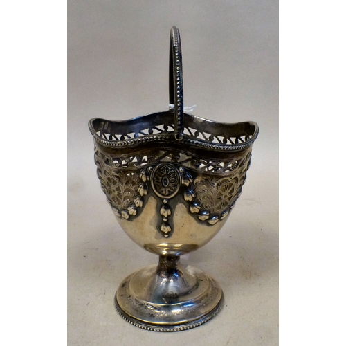 36 - A silver sugar basket of pedestal design with embossed garland ornament and a swing top handle&nbsp;... 