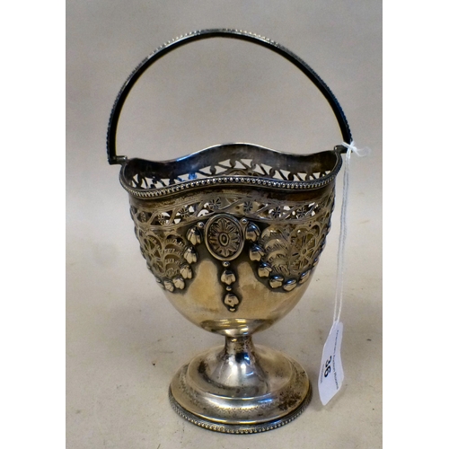 36 - A silver sugar basket of pedestal design with embossed garland ornament and a swing top handle&nbsp;... 