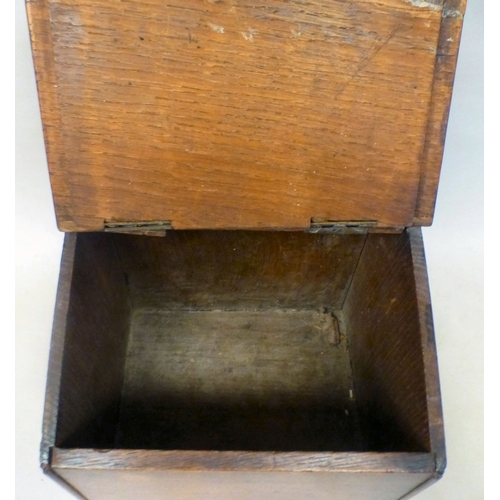 37 - A George III oak candle box with a hinged lid and base drawer&nbsp; 10
