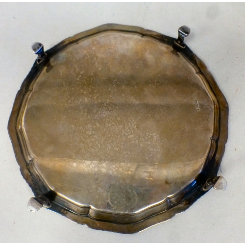 41 - A silver salver with a piecrust border, raised on pad feet&nbsp; London 1920&nbsp; 8.5