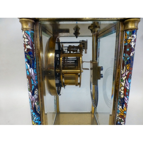 46 - A late 19thC French gilt metal champlev&eacute; enamel four glass mantel clock with a domed top and ... 