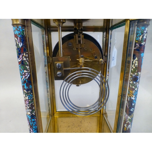 46 - A late 19thC French gilt metal champlev&eacute; enamel four glass mantel clock with a domed top and ... 