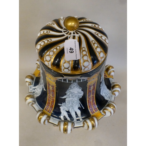 49 - A late 19thC porcelain pate-sur-pate pedestal vase and cover, decorated with panels, featuring class... 