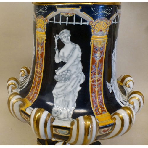 49 - A late 19thC porcelain pate-sur-pate pedestal vase and cover, decorated with panels, featuring class... 