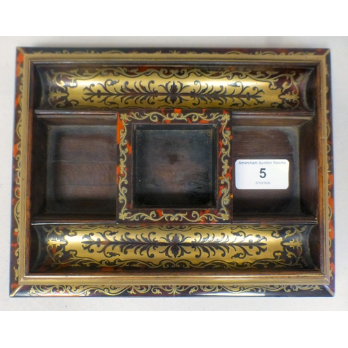 5 - A late 19thC Asprey Boulle deskstand with a glass inkwell, raised on bracket feet&nbsp; 9.5