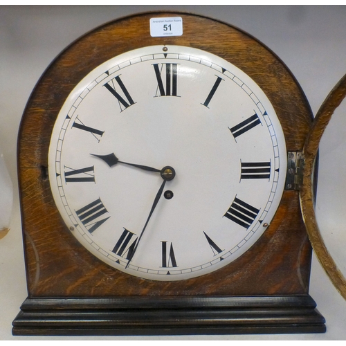 51 - An Edwardian oak cased mantel clock; the movement faced by a Roman dial&nbsp; 16