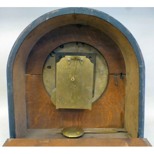 51 - An Edwardian oak cased mantel clock; the movement faced by a Roman dial&nbsp; 16