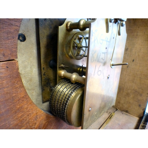 51 - An Edwardian oak cased mantel clock; the movement faced by a Roman dial&nbsp; 16