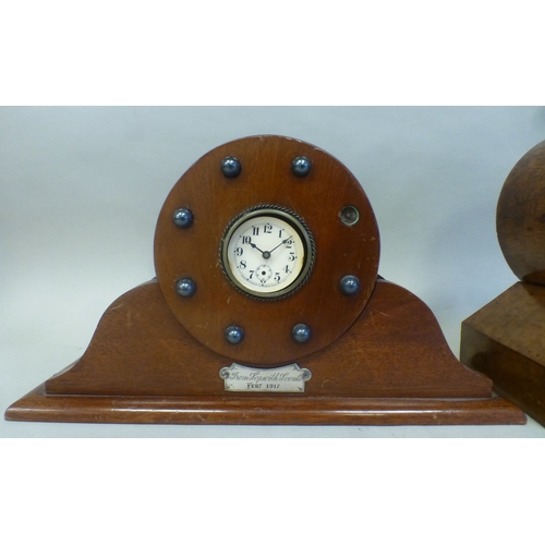 53 - Clocks: to include a late 19thC walnut cased barrel design example; the movement faced by a Roman di... 