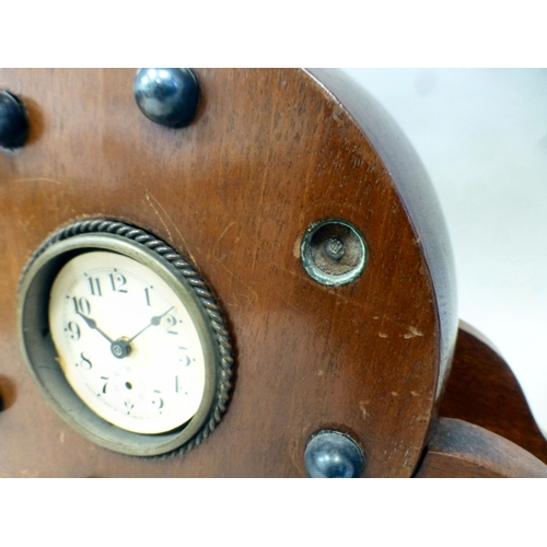 53 - Clocks: to include a late 19thC walnut cased barrel design example; the movement faced by a Roman di... 