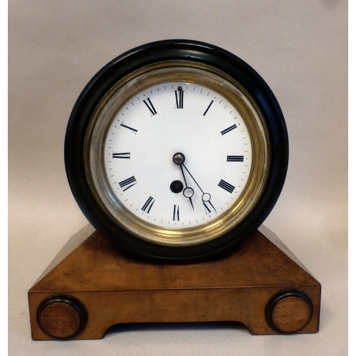 53 - Clocks: to include a late 19thC walnut cased barrel design example; the movement faced by a Roman di... 