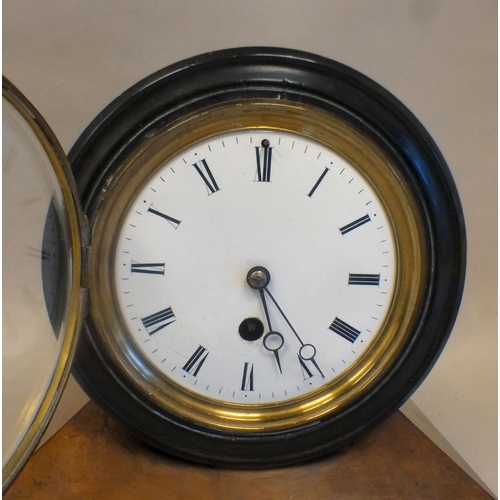 53 - Clocks: to include a late 19thC walnut cased barrel design example; the movement faced by a Roman di... 