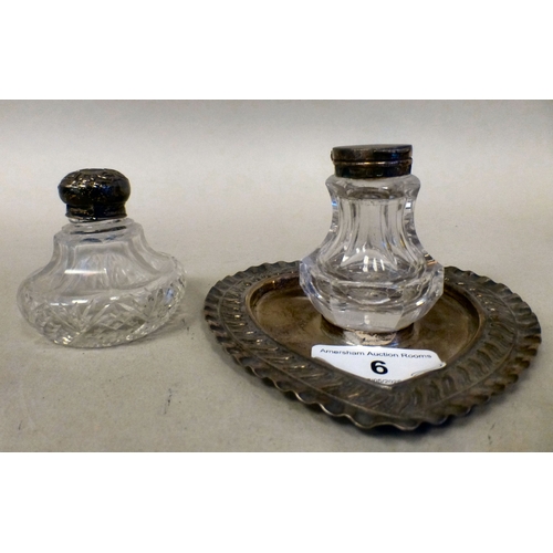 6 - Dressing table accessories: to include a silver inkwell, the glass reservoirs on a heart shaped tray... 