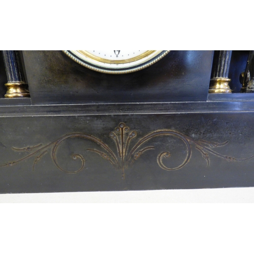8 - An early 20thC black slate cased mantel clock of architectural form, depicting a Roman battle scene ... 