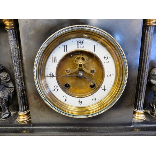8 - An early 20thC black slate cased mantel clock of architectural form, depicting a Roman battle scene ... 