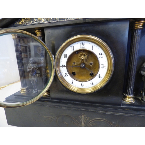 8 - An early 20thC black slate cased mantel clock of architectural form, depicting a Roman battle scene ... 